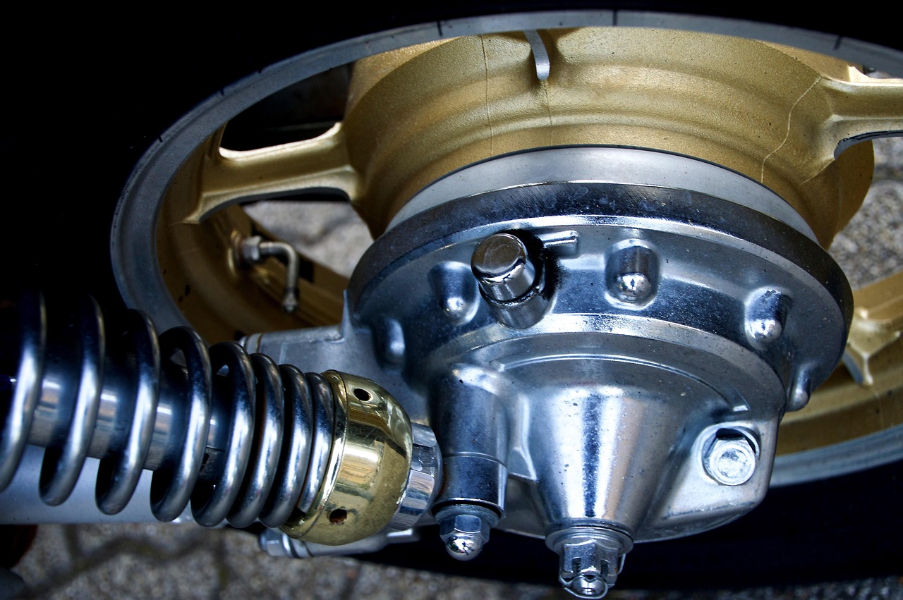 Front suspension control arm and bushing showing wear that can cause vibration during braking